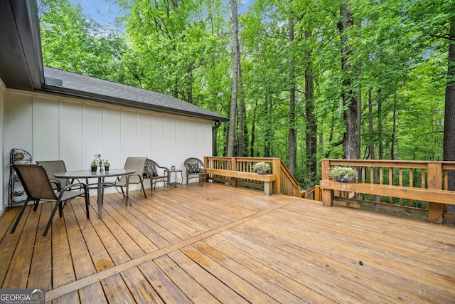 deck with outdoor dining area