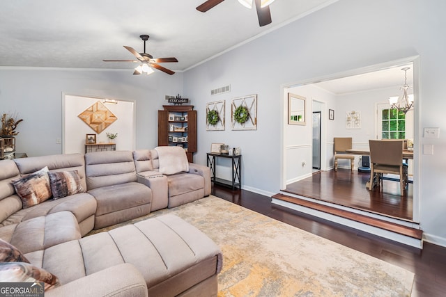 living room with visible vents, ceiling fan with notable chandelier, lofted ceiling, and dark wood-style floors
