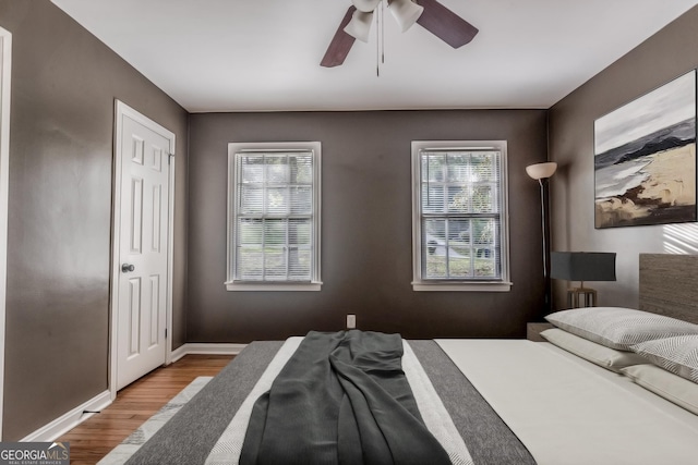 2174 Beecher Rd SW, Atlanta, GA 30311 - bedroom featuring baseboards, multiple windows, ceiling fan, and wood finished floors