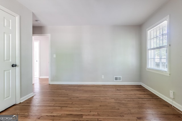 2174 Beecher Rd SW, Atlanta, GA 30311 - empty room with baseboards, visible vents, and wood finished floors