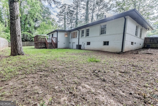 2174 Beecher Rd SW, Atlanta, GA 30311 - back of house with brick siding, fence, stairs, central AC unit, and a wooden deck