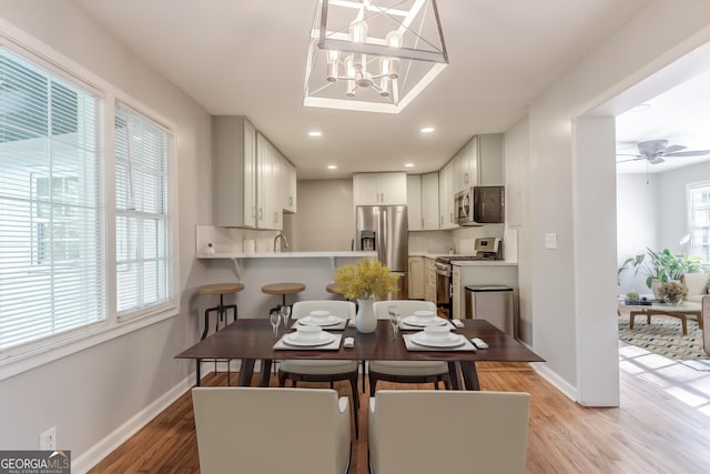 2174 Beecher Rd SW, Atlanta, GA 30311 - dining area featuring light wood-style flooring, baseboards, a notable chandelier, and recessed lighting