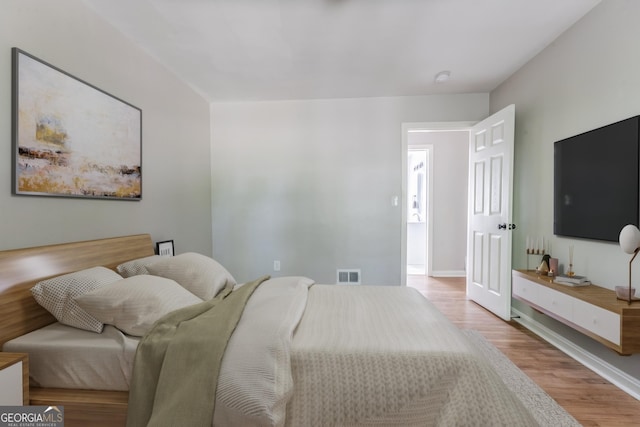 2174 Beecher Rd SW, Atlanta, GA 30311 - bedroom featuring baseboards, visible vents, and wood finished floors