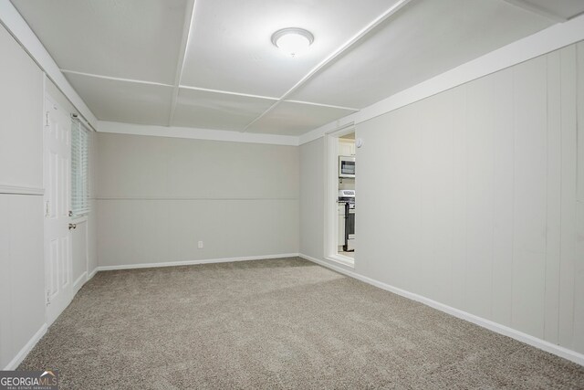 interior space featuring baseboards and carpet floors
