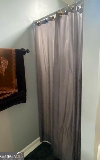 bathroom featuring baseboards