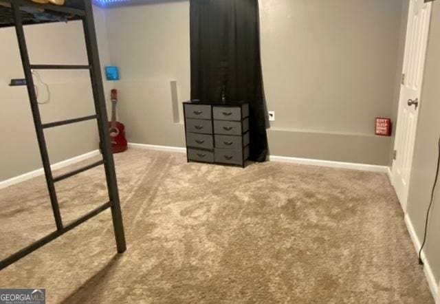 carpeted bedroom featuring baseboards