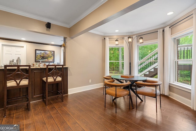 945 Hampton Bluff Dr, Milton, GA 30004 - dining area with baseboards, a dry bar, plenty of natural light, and crown molding