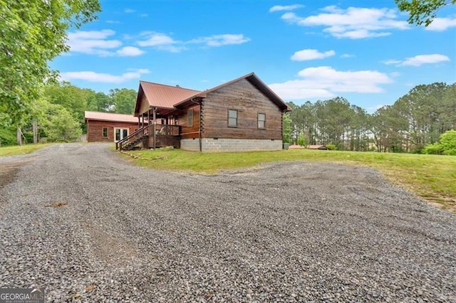 2791 Back Valley Rd, Lyerly, GA 30730 - view of side of home featuring a porch, driveway, crawl space, and metal roof