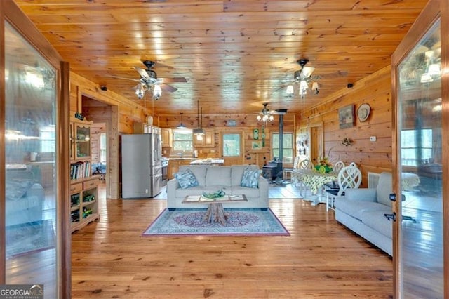2791 Back Valley Rd, Lyerly, GA 30730 - living room with wood ceiling, ceiling fan, light wood finished floors, and wooden walls