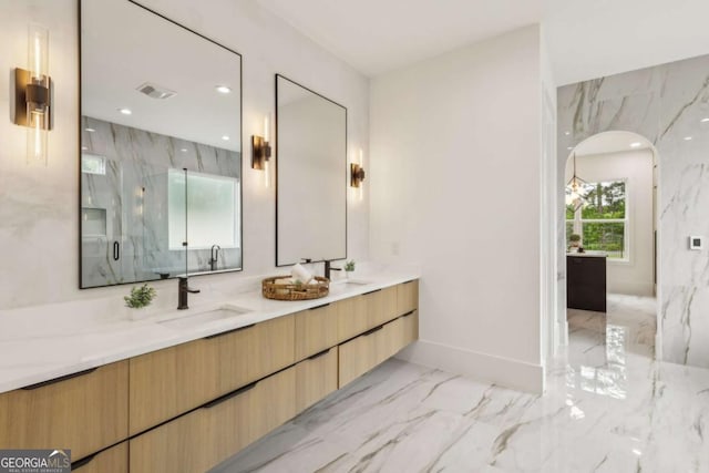 1255 E M Croy Rd, Sugar Hill, GA 30518 - bathroom featuring marble tiled flooring, a marble finish shower, double vanity, and recessed lighting