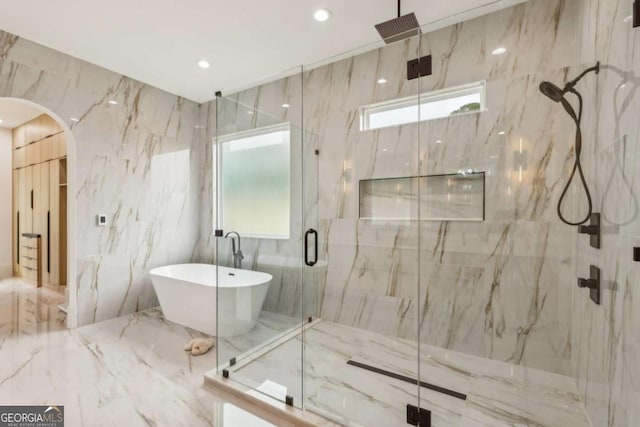 1255 E M Croy Rd, Sugar Hill, GA 30518 - bathroom with a marble finish shower, marble tiled floors, a soaking tub, and tile walls