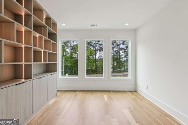 1255 E M Croy Rd, Sugar Hill, GA 30518 - spare room featuring light wood-style flooring and recessed lighting