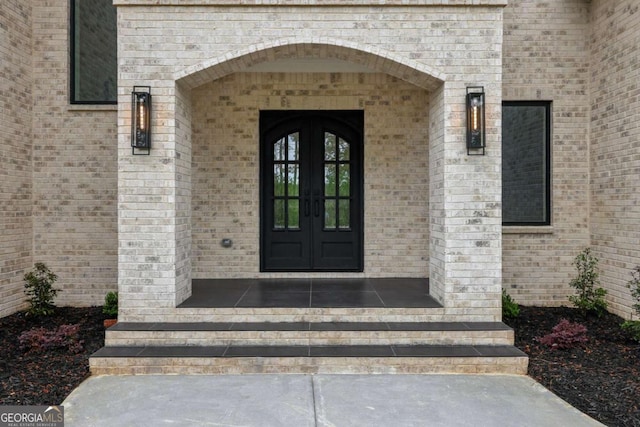 1255 E M Croy Rd, Sugar Hill, GA 30518 - property entrance featuring french doors and brick siding