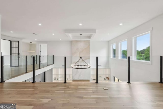 1255 E M Croy Rd, Sugar Hill, GA 30518 - unfurnished room with light wood-style floors, recessed lighting, and a chandelier