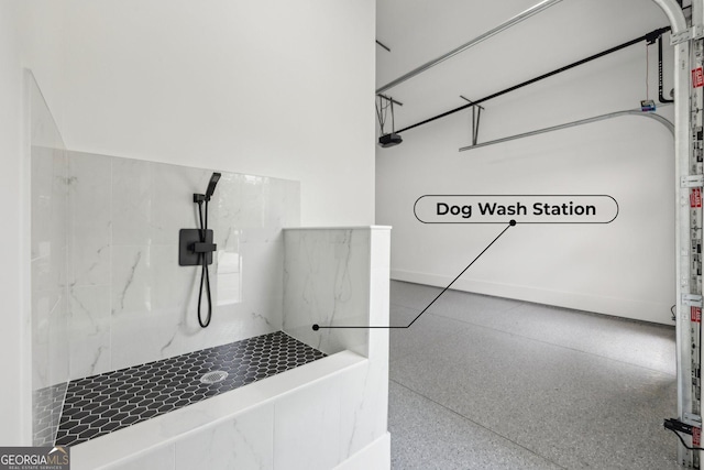 1255 E M Croy Rd, Sugar Hill, GA 30518 - full bath with a marble finish shower and speckle patterned floor