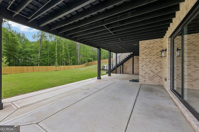 1255 E M Croy Rd, Sugar Hill, GA 30518 - fenced backyard featuring stairway, a patio, and a forest view