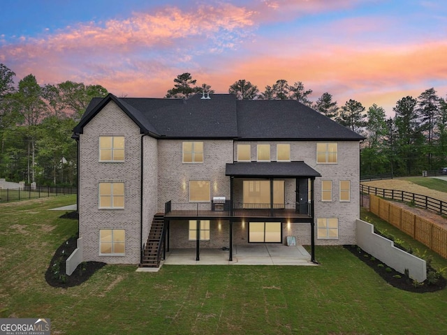 1255 E M Croy Rd, Sugar Hill, GA 30518 - back of property at dusk with a patio area, stairway, and a wooden deck