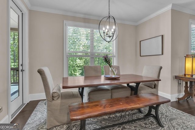 dining room featuring baseboards, ornamental molding, dark wood-style floors, and a notable chandelier