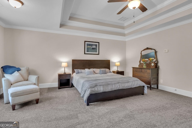 bedroom featuring carpet flooring, visible vents, ornamental molding, and a raised ceiling