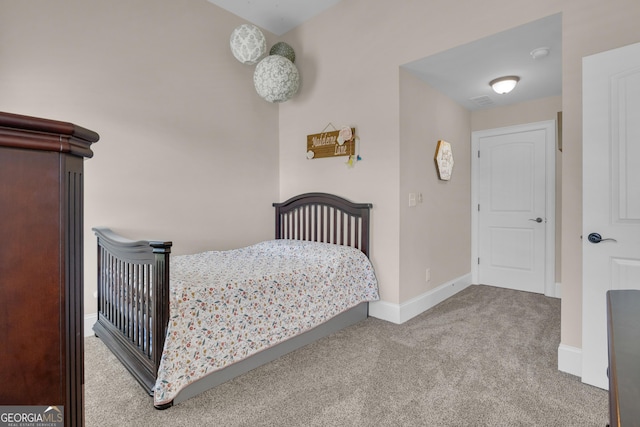 carpeted bedroom featuring baseboards