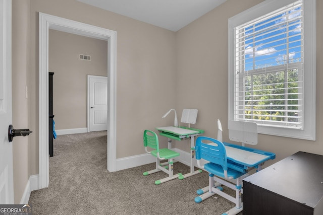 home office with baseboards, visible vents, and carpet