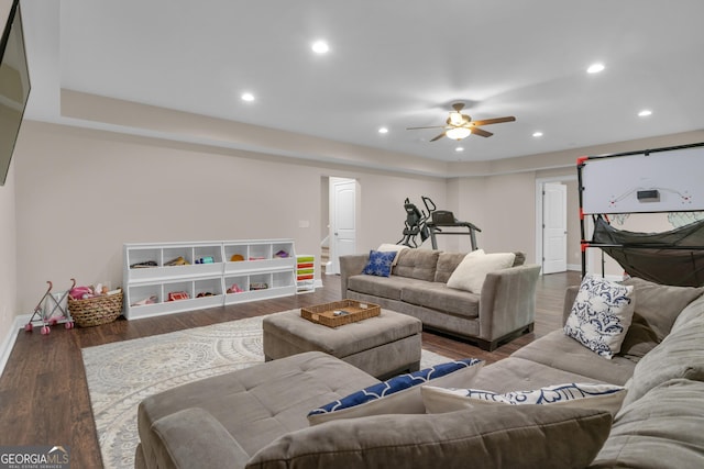 living room featuring recessed lighting, a ceiling fan, baseboards, and wood finished floors