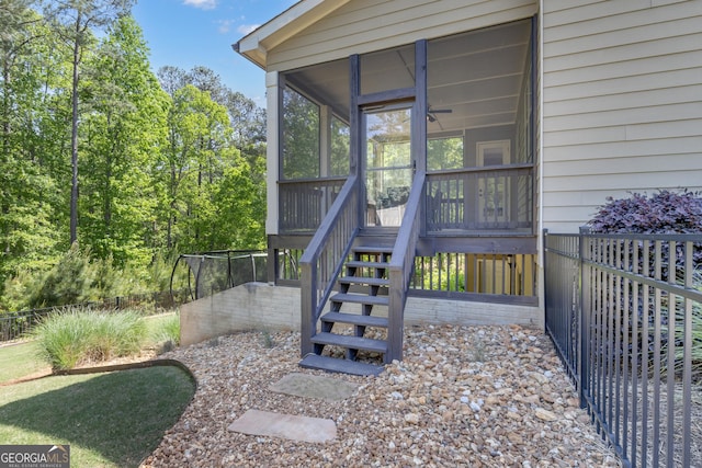 view of exterior entry with fence