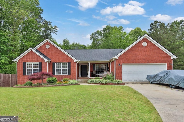 2582 Oak Bluff Dr, Dacula, GA 30019 - ranch-style home featuring covered porch, driveway, a garage, brick siding, and a front lawn
