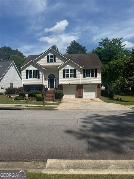 955 Tributary Way, Dacula, GA 30019 - raised ranch with driveway and a garage