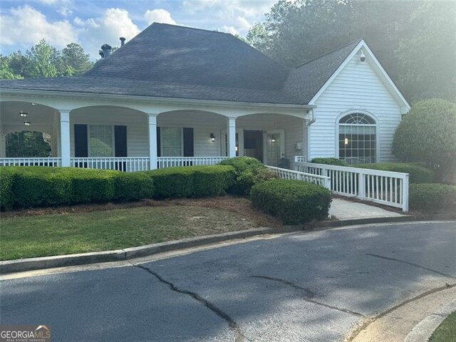 955 Tributary Way, Dacula, GA 30019 - view of front facade featuring covered porch