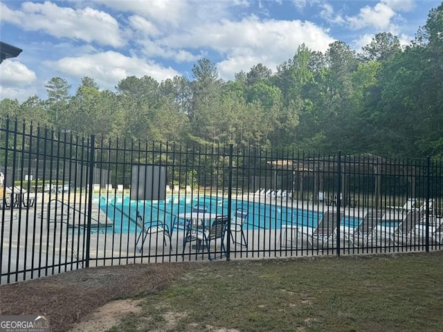 955 Tributary Way, Dacula, GA 30019 - community pool featuring a patio area