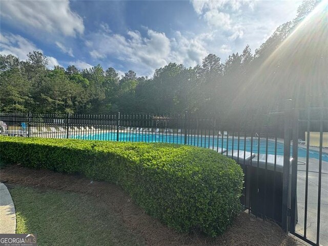 955 Tributary Way, Dacula, GA 30019 - community pool featuring fence