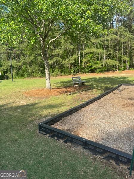 955 Tributary Way, Dacula, GA 30019 - view of home's community with a yard and a game area