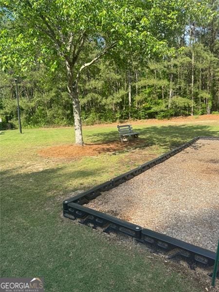 955 Tributary Way, Dacula, GA 30019 - view of community featuring a lawn and a game area