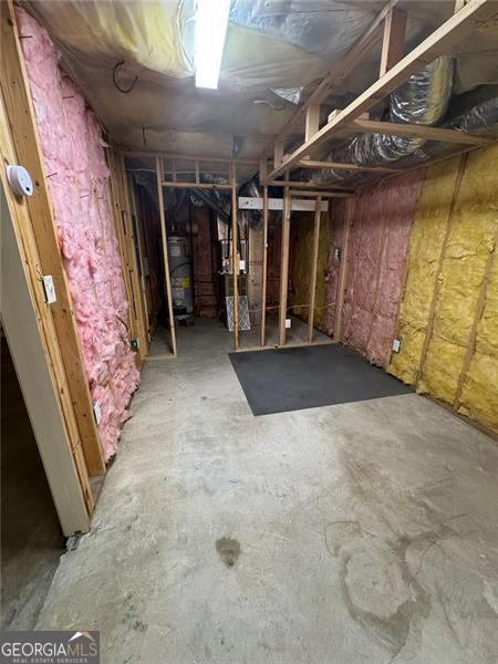 955 Tributary Way, Dacula, GA 30019 - unfinished basement featuring strapped water heater