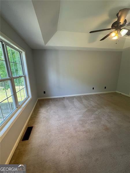 955 Tributary Way, Dacula, GA 30019 - spare room featuring baseboards, carpet floors, ceiling fan, and a tray ceiling