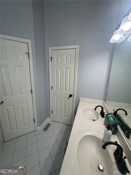 955 Tributary Way, Dacula, GA 30019 - bathroom with tile patterned flooring and double vanity