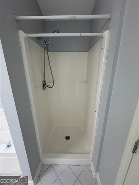 955 Tributary Way, Dacula, GA 30019 - bathroom with tile patterned flooring, walk in shower, and baseboards