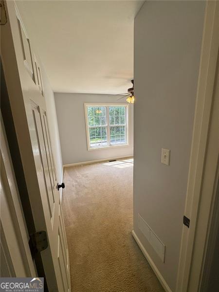 955 Tributary Way, Dacula, GA 30019 - hallway with carpet and baseboards