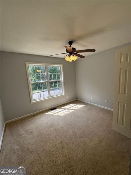 955 Tributary Way, Dacula, GA 30019 - carpeted empty room featuring ceiling fan and baseboards