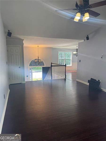 955 Tributary Way, Dacula, GA 30019 - spare room featuring a chandelier, wood finished floors, and a ceiling fan