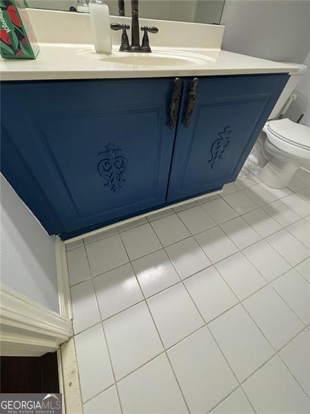 955 Tributary Way, Dacula, GA 30019 - half bathroom featuring vanity and toilet