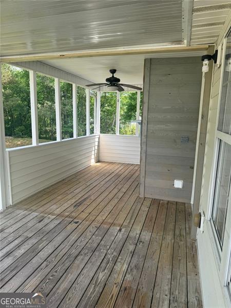 955 Tributary Way, Dacula, GA 30019 - unfurnished sunroom featuring ceiling fan