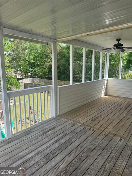 955 Tributary Way, Dacula, GA 30019 - wooden terrace featuring fence