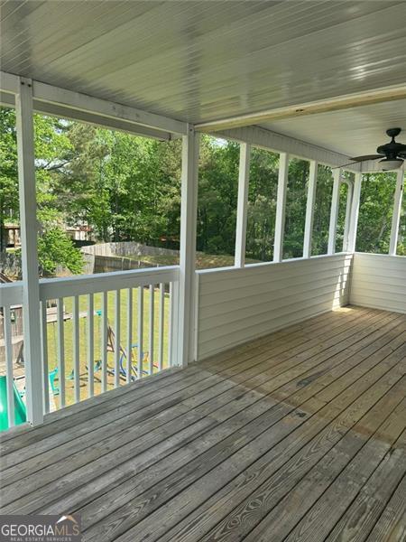 955 Tributary Way, Dacula, GA 30019 - wooden terrace featuring a fenced backyard and a swimming pool