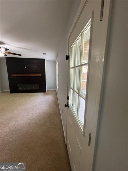 955 Tributary Way, Dacula, GA 30019 - corridor with carpet floors and baseboards