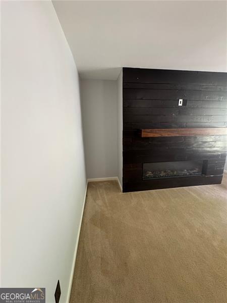 955 Tributary Way, Dacula, GA 30019 - empty room featuring carpet floors and baseboards