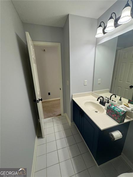 955 Tributary Way, Dacula, GA 30019 - bathroom with vanity and tile patterned flooring