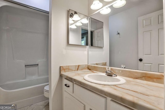 2302 Colonial Dr NE, Brookhaven, GA 30319 - full bath featuring shower / bathing tub combination, vanity, toilet, and marble finish floor