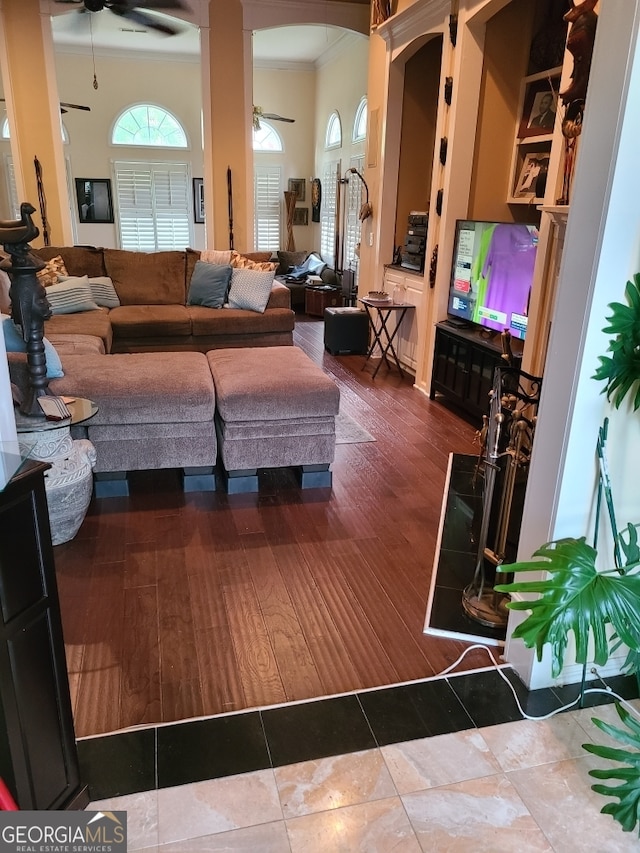 4955 Highland Lakes Dr, South Fulton, GA 30349 - living area featuring crown molding, arched walkways, and ceiling fan